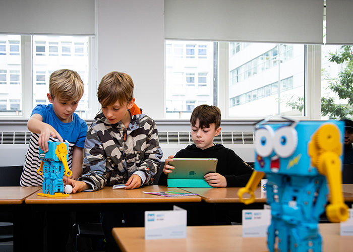 Boys playing with robots